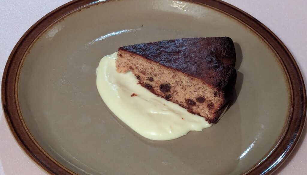 Fruit cake with home made custard.